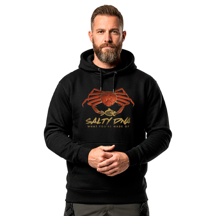 Man wearing a black Salty Species snow crab hoodie