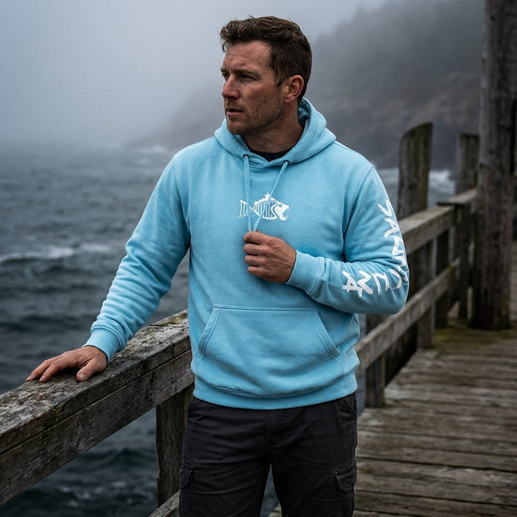 Man wearing an ivory Salty DNA quarter-zip sweatshirt
